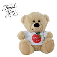 Teddy bear wearing a shirt with an apple design and 'Thank You' text on a white background.