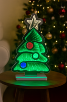 Christmas tree decoration with glowing LED star and ornaments