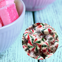 Colorful candy in a bowl on a textured surface