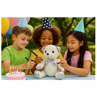 Children with a teddy bear and birthday cake outdoors
