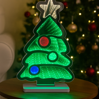Christmas tree decoration with glowing LED star and ornaments