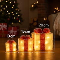 Decorative light-up gift boxes with measurements in a festive setting