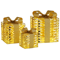 Set of three gold gift boxes with LED lights on a white background
