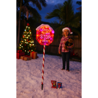 Santa Stop sign LED stake in snowy garden scene

