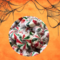 Colorful candy swirls on an orange background with spider web designs

